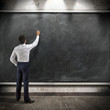 © Romolo Tavani - businessman presents a written report on a blackboard