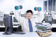 © Creativa Images - Obesity businessman working while workout 1