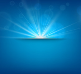 blurry blue background with lens flare.