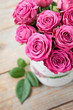 Bouquet of beautiful pink roses on wooden background.