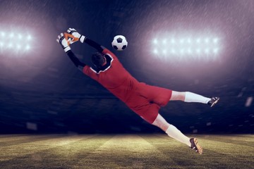 Aufkleber - Composite image of goalkeeper in red jumping up