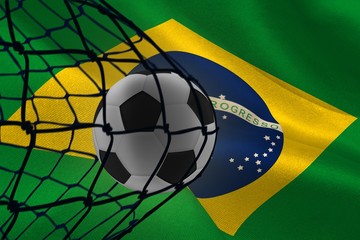 Aufkleber - Composite image of football in back of the net