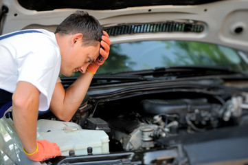 Car mechanic in auto repair service