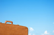 old vintage suitcase and sky background