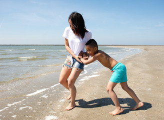 Sticker - Mother and son playing at the beach