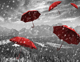 Fototapeta Uliczki - flying red umbrellas in the mountains during a storm