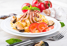 Pasta With Mussels And Octopus On Wooden Background