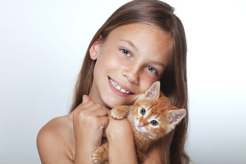 Wall Mural - Kid girl with kitten