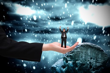 Poster - Composite image of businessman cheering at the camera in large h