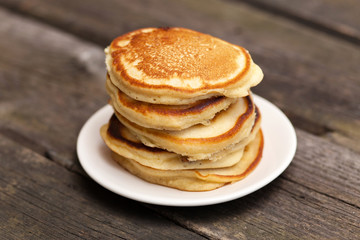 Delicious pancakes on a wooden table