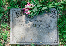 Flowers On Mothers Grave Marker