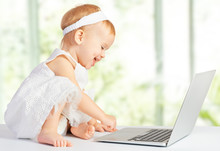 Baby Girl At  Laptop Computer