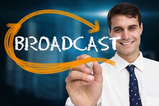 Businessman writing the word broadcast