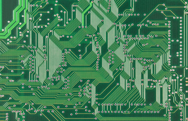 close up of a printed green computer circuit board