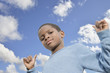 Young boy, blue sky and sunny day