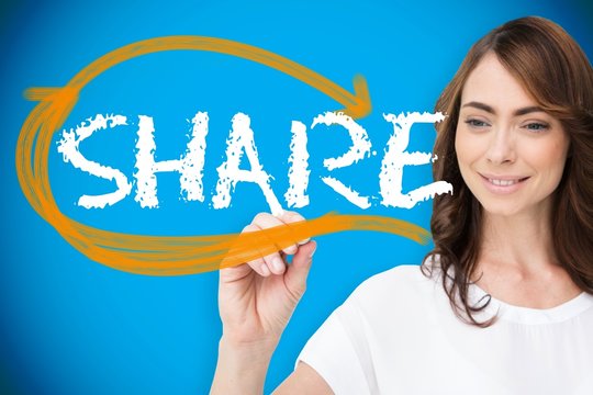 Businesswoman writing the word share
