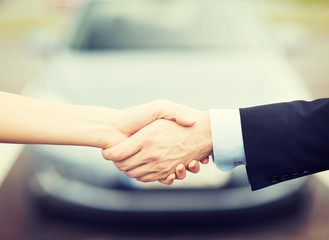 customer and salesman shaking hands