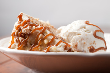 Maple Walnut Cinnamon Cake with vanilla ice cream with white background