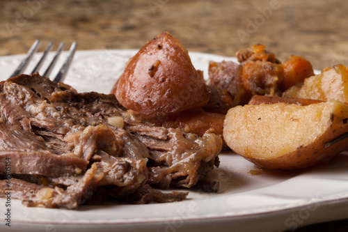 Fotografie, Obraz Macro shot of organic grass fed beef roast dinner with red potatoes and carrots