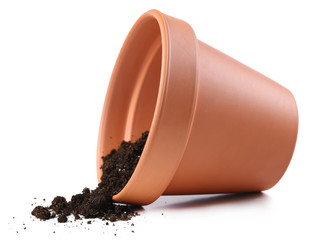 Clay flower pot with soil, isolated on white