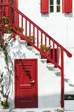 Close-up Of Traditional White House With Red Railing, Door And S