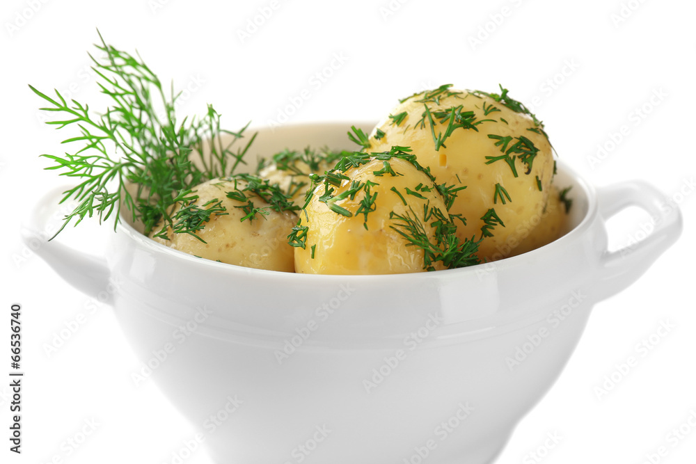 Young boiled potatoes in bowl, isolated on white
