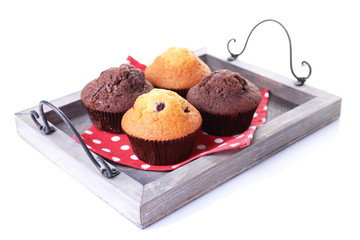 Canvas Print - Tasty muffins on wooden tray isolated on white