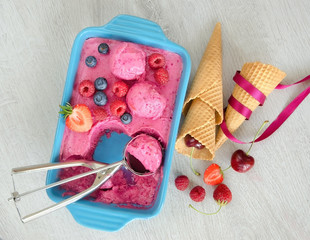 Wall Mural - Fruit ice cream with berries and cones