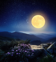 full moon in the mountains