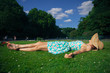 © LoloStock - Young woman with hat relaxing in park