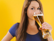 Young Woman Drinking Beer