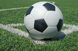 Fototapeta Sport - Soccer ball green grass field