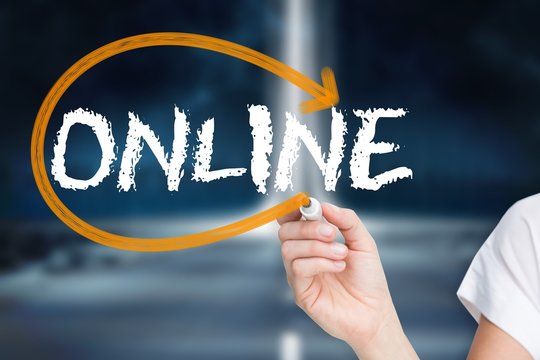Businesswoman writing the word online