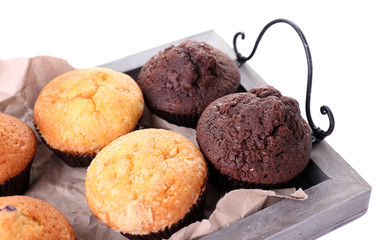 Canvas Print - Tasty muffins on wooden tray isolated on white