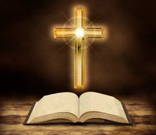Bible And Shining Crucifix