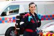 female paramedic carrying lifepack