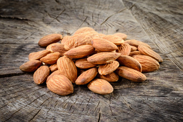 Wall Mural - Almonds on wooden background