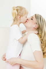 portrait of little girl with her pregnant mother