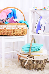 Wall Mural - Colorful towels and clothes in baskets