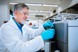 © lightpoet - Senior male researcher carrying out scientific research in a lab