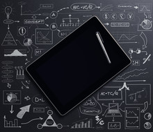 A Tablet Computer On A Black Background With Diagrams