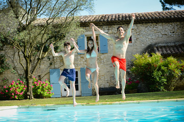 group friends jumping resorts swimming pool summer holidays