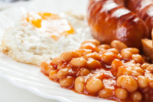 Full English Breakfast With Bacon, Sausage, Egg And Baked Beans
