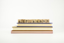 Afrikaans Language Word On Wood Stamps And Books