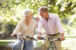 © Monkey Business - Senior couple cycling in park