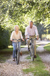 © Monkey Business - Senior couple cycling in park