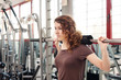© pio3 - Young woman training in the gym.