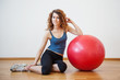 © pio3 - Young woman portrait with ball in the gym.