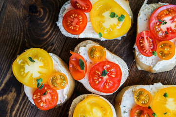 Wall Mural - Bruschetta sandwiches on wooden background