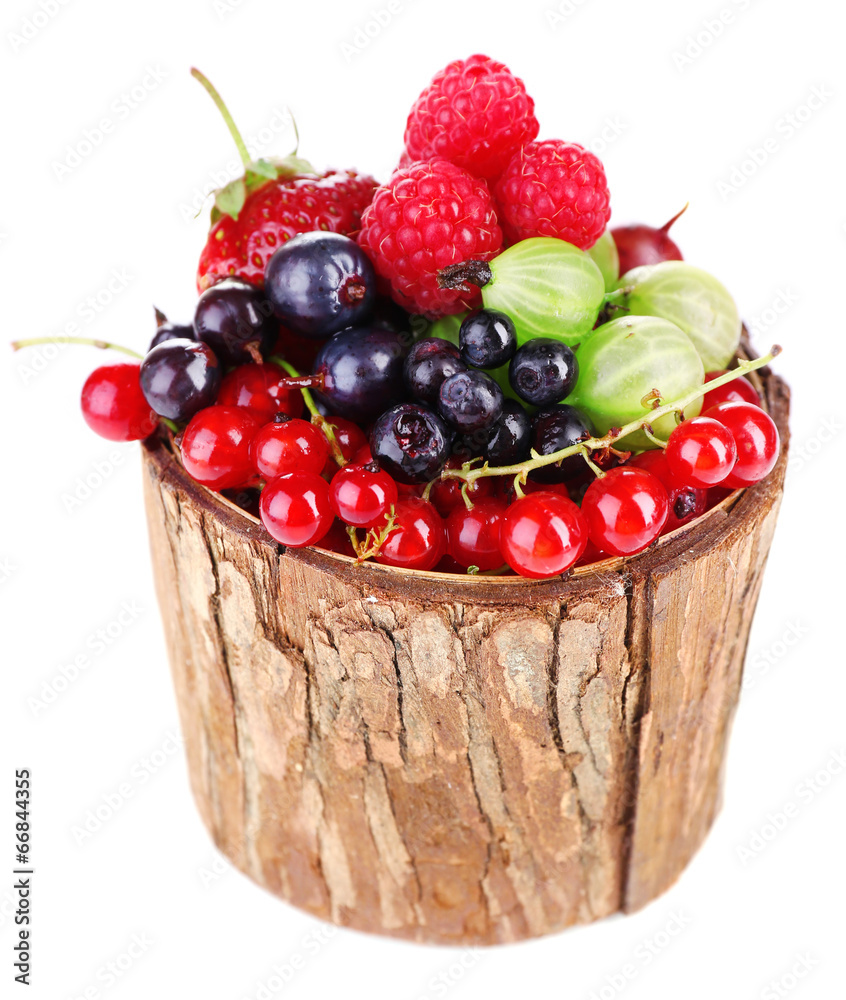 Forest berries in wooden box, isolated on white